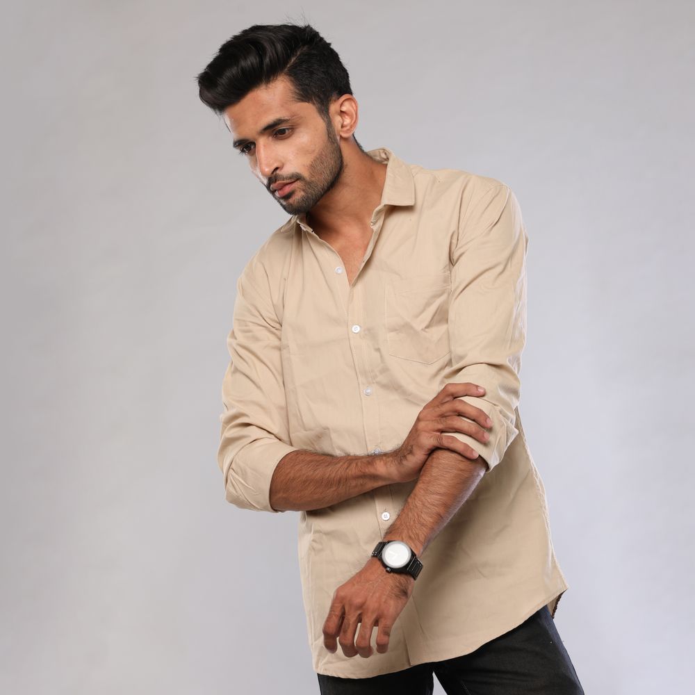 Male model wearing a beige casual shirt