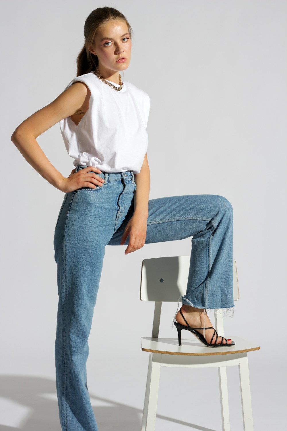 Woman wearing a white sleeveless top